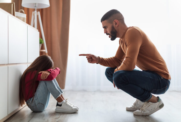 Family Conflict. Angry father scolding sad daughter